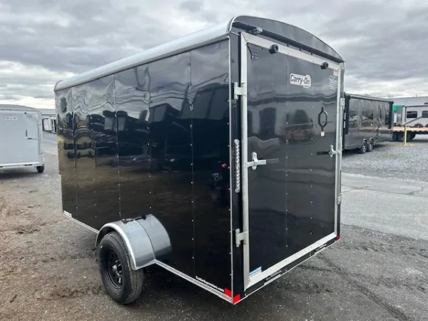 2025-CARRY-ON-ENCLOSED-CARGO-TRAILER-RAMP-DOOR-DING-AND-DENT-2.webp Ding & Dent Carry-On 6 x 12 Enclosed Trailer