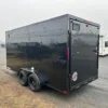 2025-HOMESTEADER-ENCLOSED-CARGO-TRAILER-RAMP-DOOR-ADDED-HEIGHT-BLACK-TRIM-1-1.webp Homesteader 7 x 16 V-Nose Enclosed Cargo Trailer