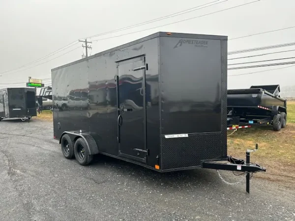 2025-HOMESTEADER-ENCLOSED-CARGO-TRAILER-RAMP-DOOR-ADDED-HEIGHT-BLACK-TRIM-3.webp Homesteader 7 x 16 V-Nose Enclosed Cargo Trailer