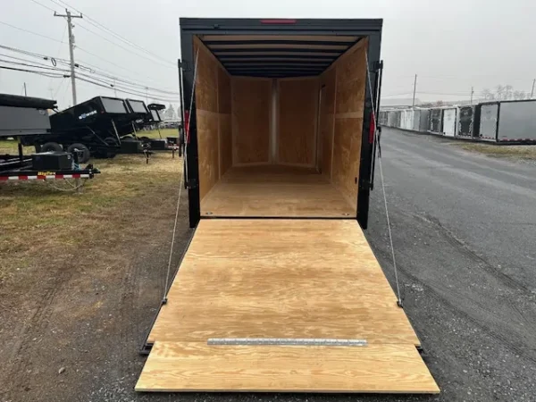 2025-HOMESTEADER-ENCLOSED-CARGO-TRAILER-RAMP-DOOR-ADDED-HEIGHT-BLACK-TRIM-5-1.webp Homesteader 7 x 16 V-Nose Enclosed Cargo Trailer