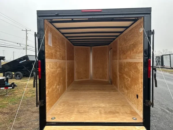 2025-HOMESTEADER-ENCLOSED-CARGO-TRAILER-RAMP-DOOR-ADDED-HEIGHT-BLACK-TRIM-6.webp Homesteader 7 x 16 V-Nose Enclosed Cargo Trailer
