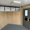 Car-Mate-8.5x20-Enclosed-Cargo-Trailer-V-Nose-Windows-Cabinets-AC-Unit-Electrical-Package-Aluminum-Wheels-7.webp Car Mate 8.5 x 20 Enclosed V-Nose Cargo Trailer